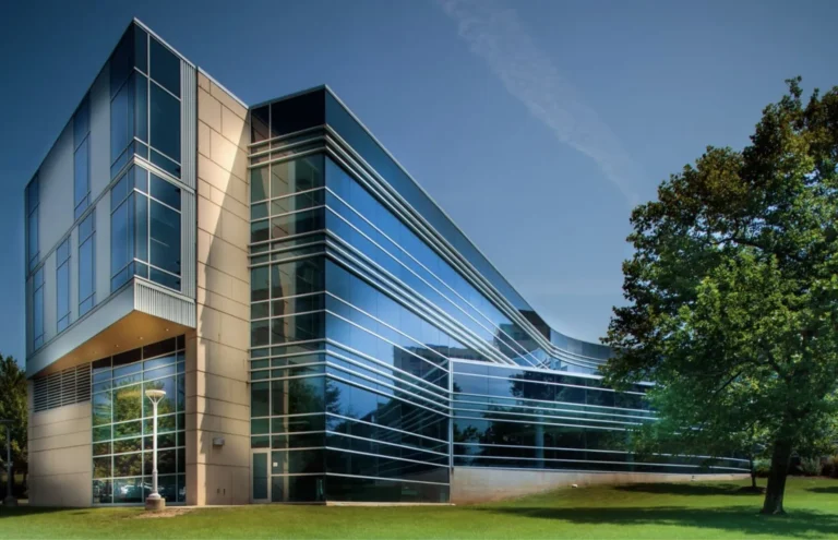 Modern blue glass building at Geisinger – University of Pittsburgh
